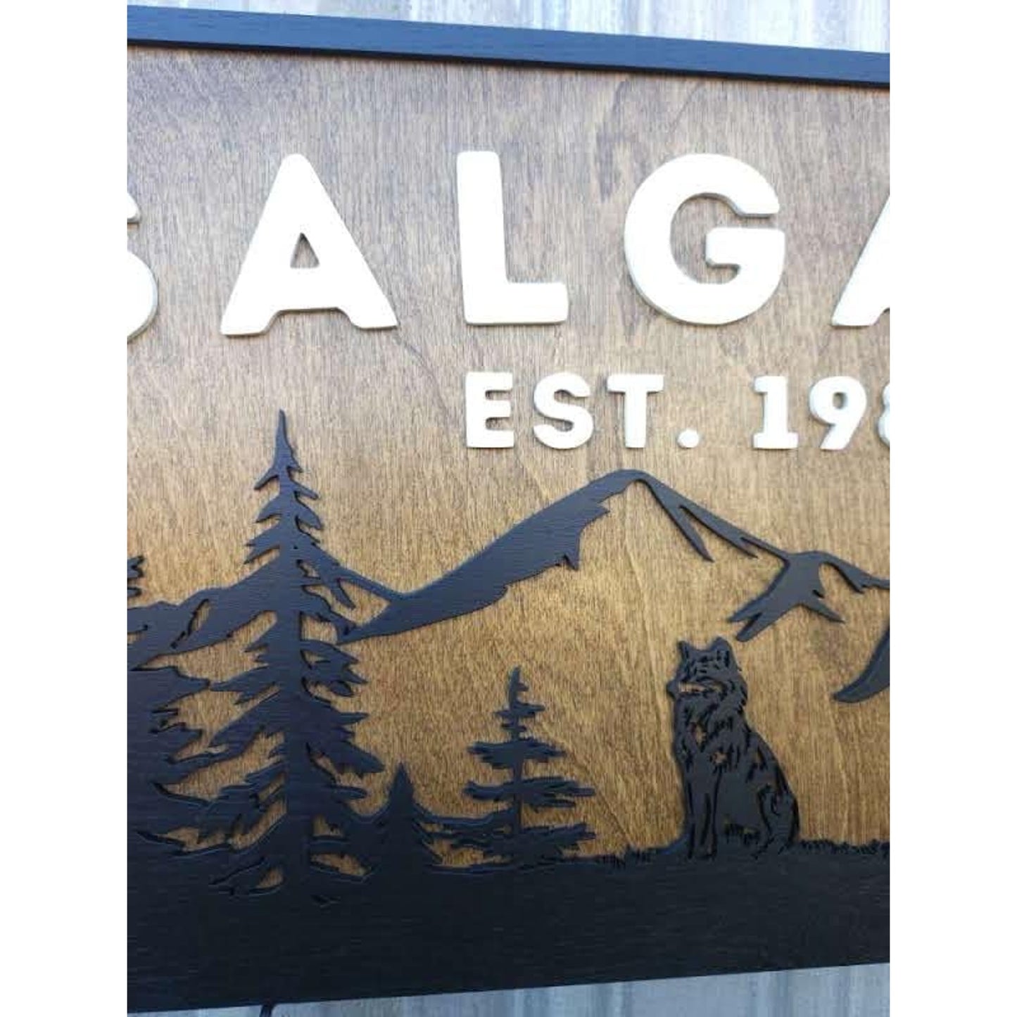 Personalized Rustic Wooden Family Name Sign With Mountain, Trees, and a Wolf